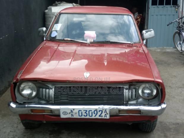 Nissan 100 1975 Burgundy