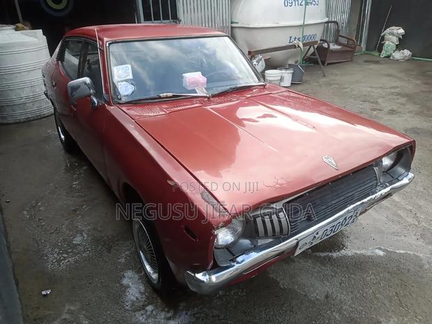Nissan 100 1975 Burgundy